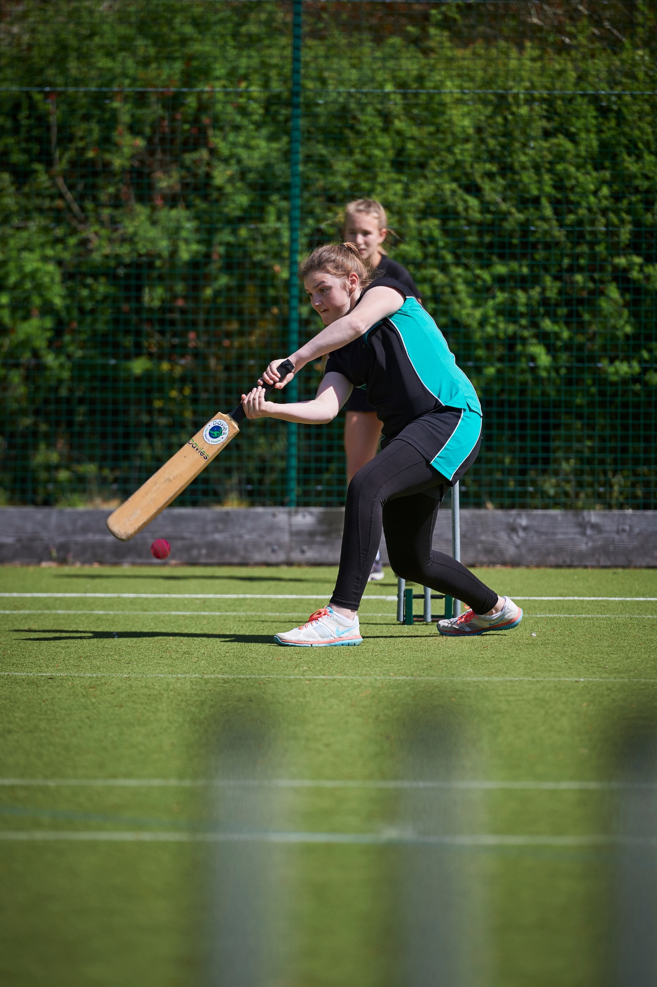 Student playing cricket