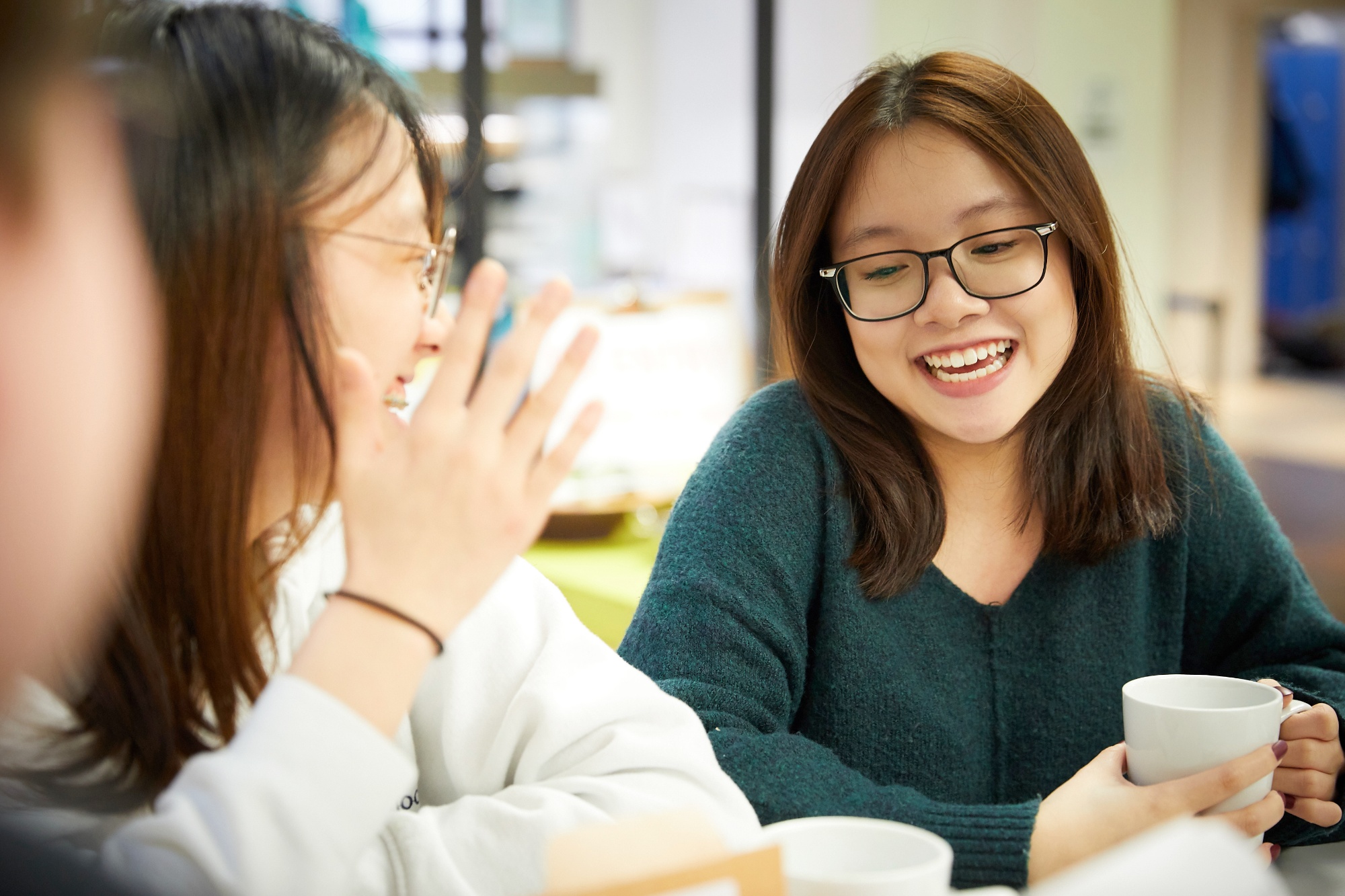 Image of students in dining hall to illustrate link to 'Living overseas' page