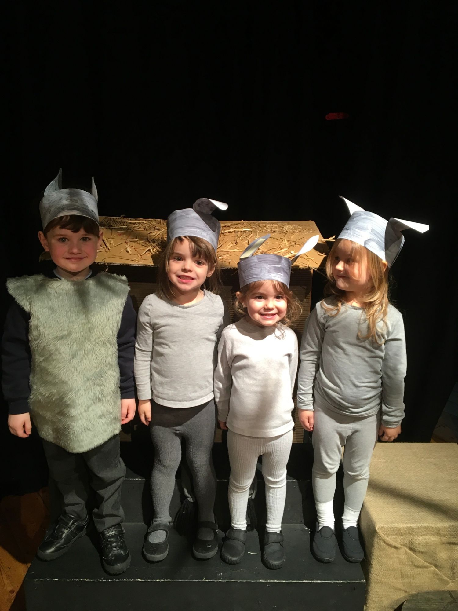 Four children dressed up as donkeys for the nativity