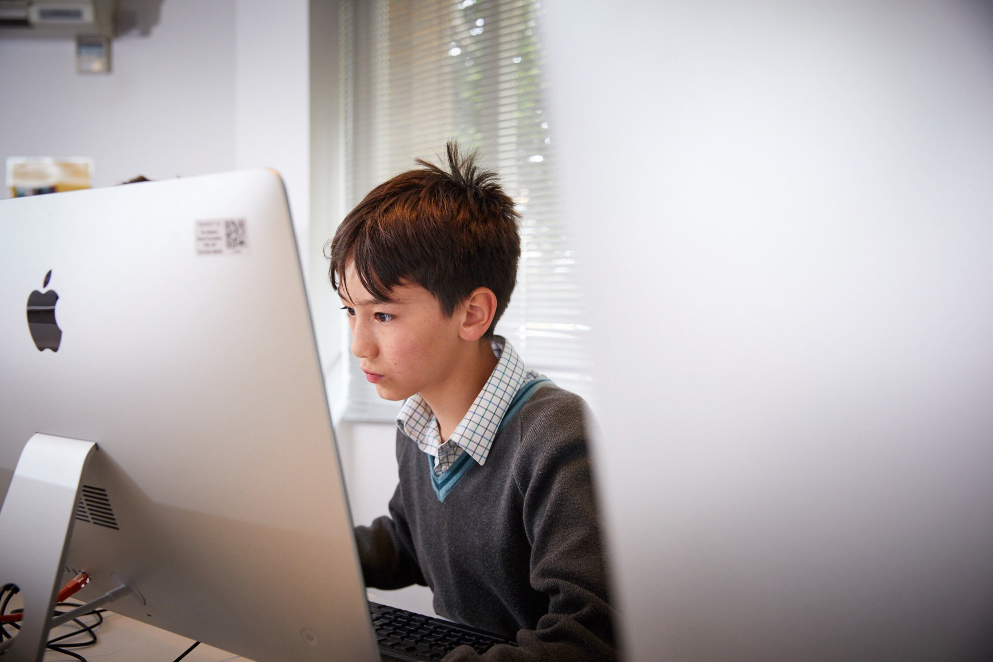 Student on computer to illustrate link to 'Digital learning' page